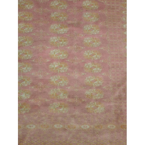 737 - A pink ground Oriental Rug 5ft 6in L x 4ft W and a red ground Runner 9ft 2in L x 2ft 3in W