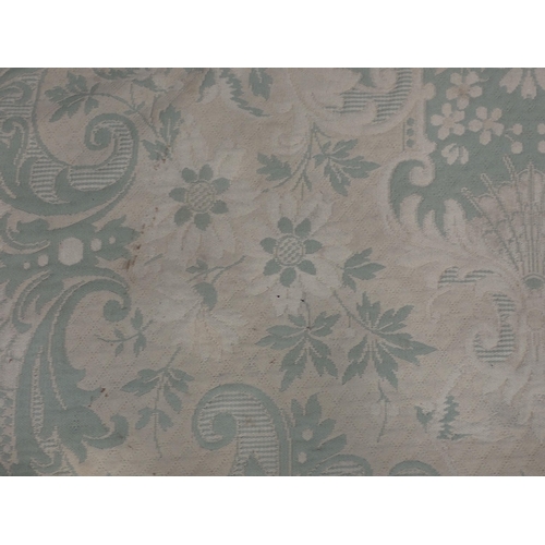 738 - A cream and pale green ground Carpet with floral design 9ft 6in L x 6ft 4in W