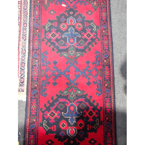 739 - A red ground Rug with intricate floral decoration within cream border 7ft L x 4ft 10in W and a red g... 