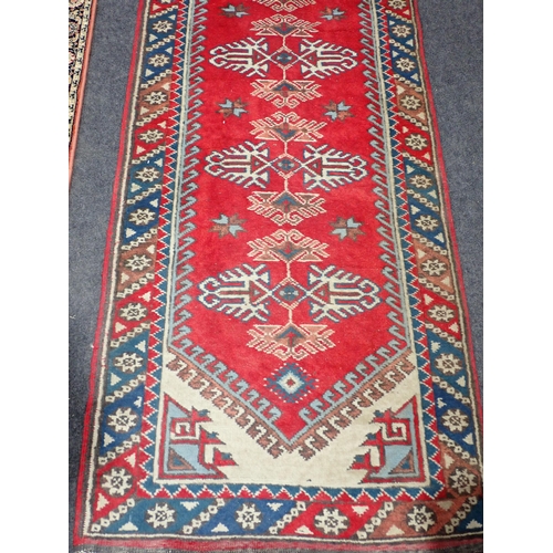 740 - A red ground Rug with beige central medallion and trailing floral design within tramline border 6ft ... 