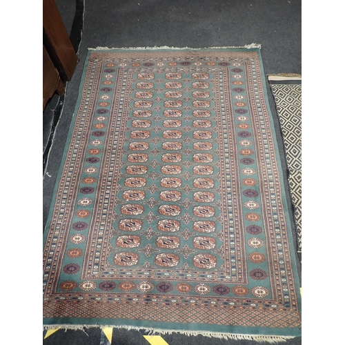 741 - A turquoise Rug with three rows of medallions within tramline border 6ft L x 4ft 2in W and another g... 