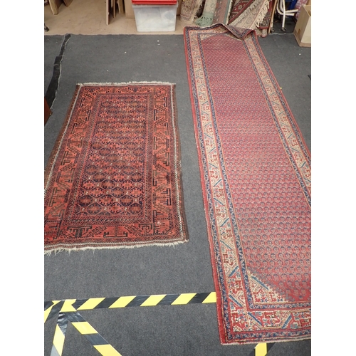 742 - A Persian red ground Rug with zig zag border 5ft 7in L x 3ft 1in W and a red ground Runner within cr... 