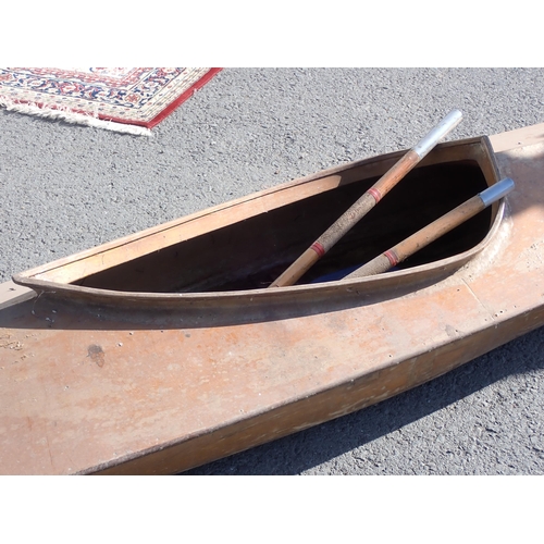 751 - A wooden Canoe with paddles 13ft L x 2ft 3in W