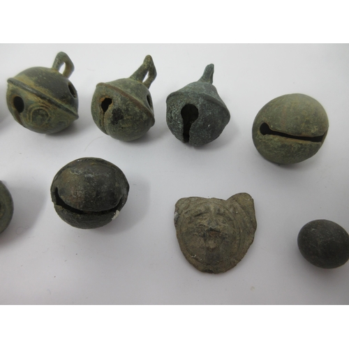 82 - Nine various antique Crotal Bells, some with initials, early metal Spoon, Rings, Bowl, Coin, Pointer