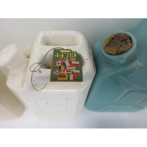 85 - A small Junior Shell Oil Can, four ceramic and one miniature Jerry Cans