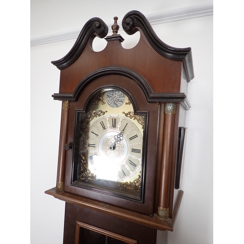 9 - A reproduction Longcase Clock with arched brass dial marked ECS Westminster, Germany, and having gla... 