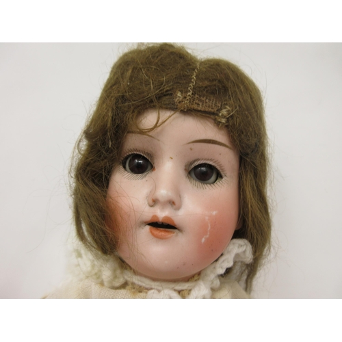 95 - A Schoenau & Hoffmeister bisque headed Doll with open mouth, moving eyes, jointed composition limbs,... 