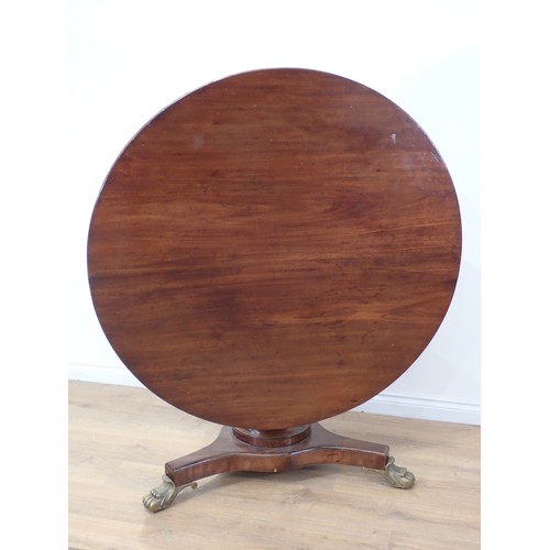 359 - A 19th Century mahogany Breakfast Table with tilting circular top on turned column, the triform base... 