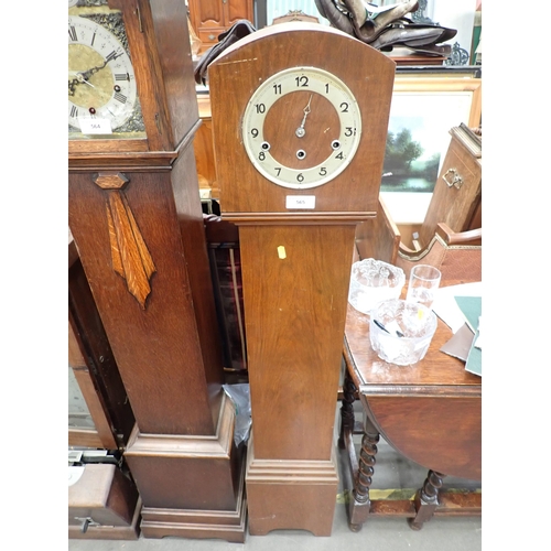 565 - An Art Deco walnut veneered Grandmother Clock, missing one hand 4ft 6in H x 10in W