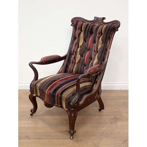 569 - A Victorian mahogany framed open Armchair and a mahogany framed Carolean style Armchair