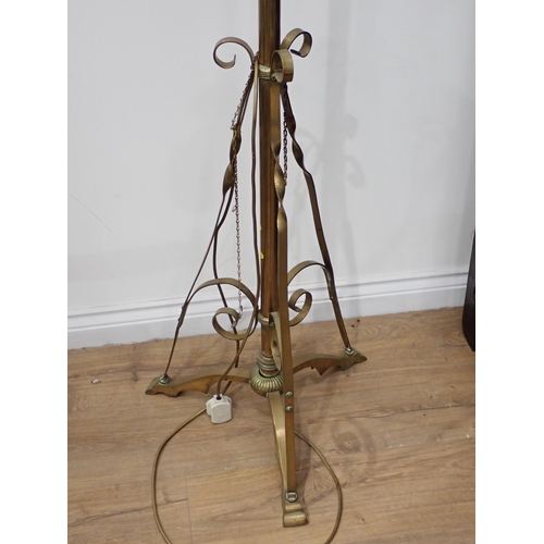 634 - A brass telescopic Standard Lamp on scrolled tripod base with Lampshade, failed PAT (wrong flex)