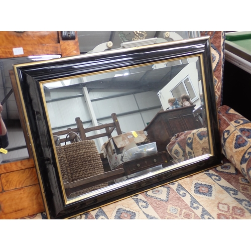 639 - A 19th Century satinwood and ebonised Wall Mirror, an ebonised Wall Mirror and a modern Wall Mirror ... 