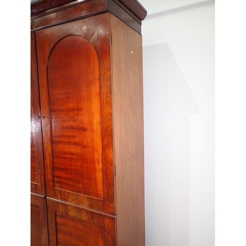 9 - A 19th Century mahogany Wardrobe fitted pair of arched panel doors on plinth base 7ft 3in H x 4ft 5i... 