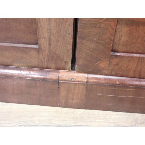 689 - A 19th Century mahogany Wardrobe fitted pair of arched panel doors on plinth base 7ft 3in H x 4ft 5i... 