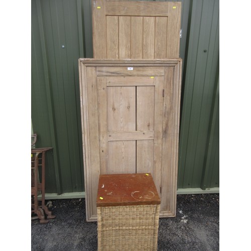 762 - An exterior Door, a pine Cupboard Door and frame, and a cane Linen Basket