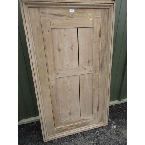 762 - An exterior Door, a pine Cupboard Door and frame, and a cane Linen Basket