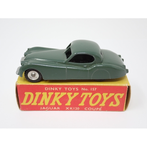 1135 - A rare boxed Dinky Toys No.157 green Jaguar XK120 Coupe with spun green hubs