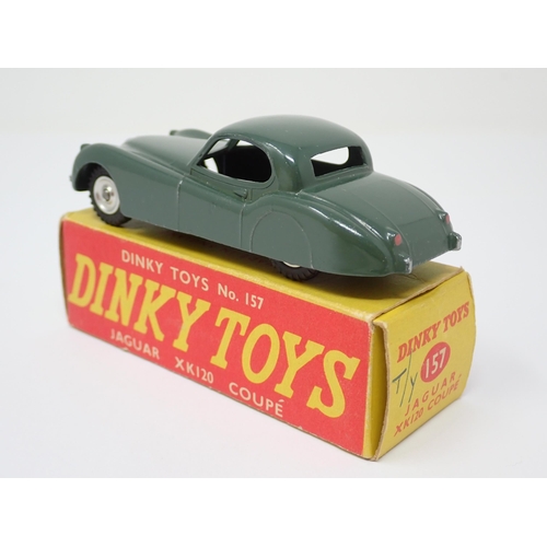 1135 - A rare boxed Dinky Toys No.157 green Jaguar XK120 Coupe with spun green hubs