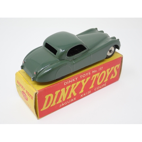 1135 - A rare boxed Dinky Toys No.157 green Jaguar XK120 Coupe with spun green hubs