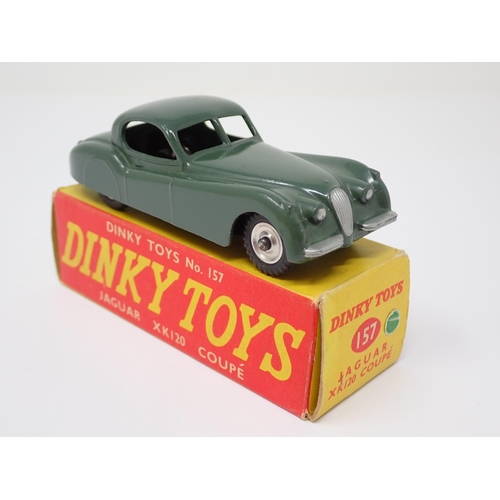 1135 - A rare boxed Dinky Toys No.157 green Jaguar XK120 Coupe with spun green hubs