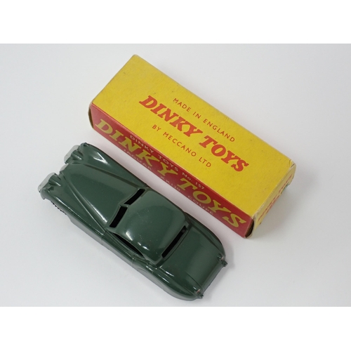 1135 - A rare boxed Dinky Toys No.157 green Jaguar XK120 Coupe with spun green hubs