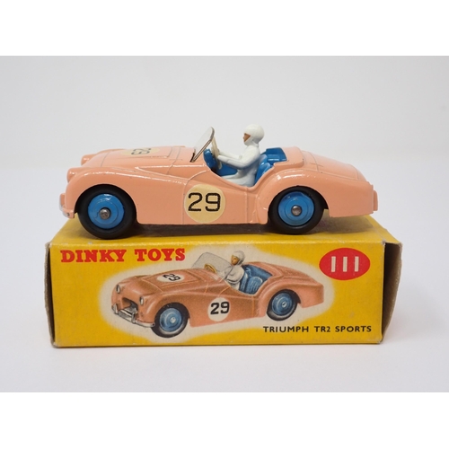 1137 - A boxed Dinky Toys No.111 pink Triumph TR2 Sports