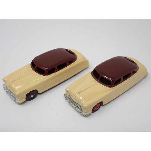 1153 - A Dinky Toys Trade Box containing two cream and maroon No139B Hudson Commodore Sedans