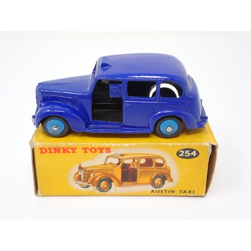 1156 - A rare boxed Dinky Toys No.254 violet blue Austin Taxi with light blue hubs