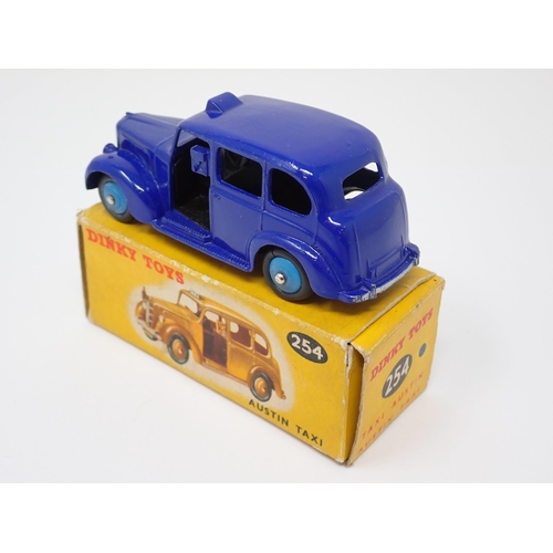 1156 - A rare boxed Dinky Toys No.254 violet blue Austin Taxi with light blue hubs