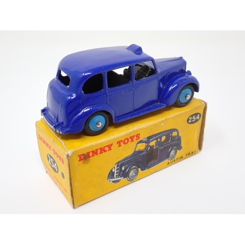 1156 - A rare boxed Dinky Toys No.254 violet blue Austin Taxi with light blue hubs