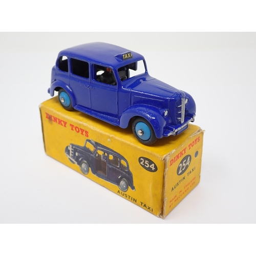 1156 - A rare boxed Dinky Toys No.254 violet blue Austin Taxi with light blue hubs