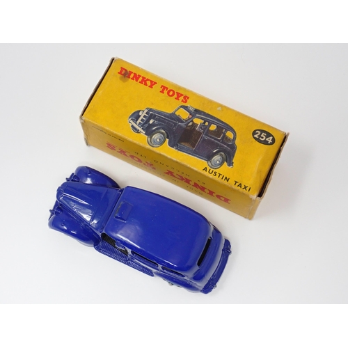 1156 - A rare boxed Dinky Toys No.254 violet blue Austin Taxi with light blue hubs