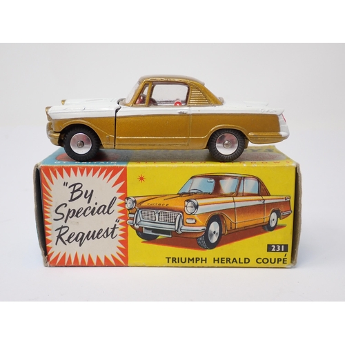 1206 - A boxed Corgi Toys No.231 gold and white Triumph Herald