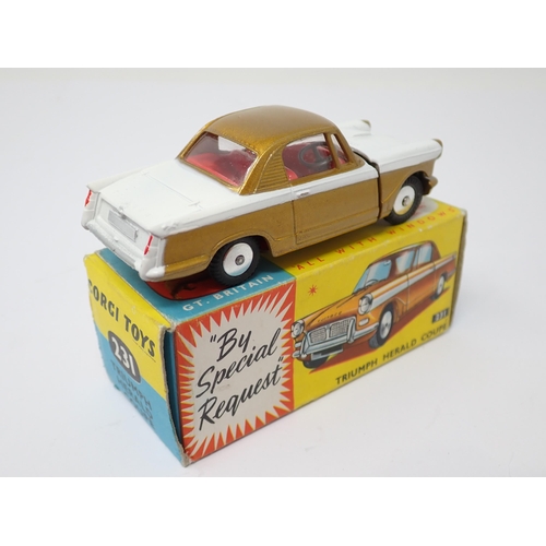 1206 - A boxed Corgi Toys No.231 gold and white Triumph Herald