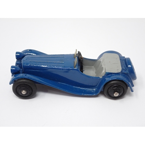 1226 - An unboxed Dinky Toys No38F dark blue Jaguar SS100