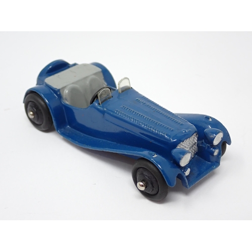 1226 - An unboxed Dinky Toys No38F dark blue Jaguar SS100