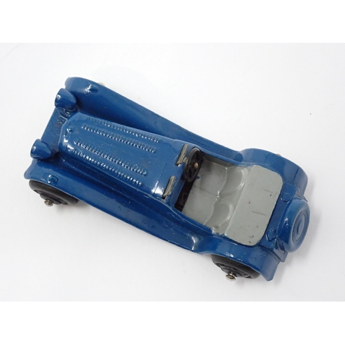 1226 - An unboxed Dinky Toys No38F dark blue Jaguar SS100