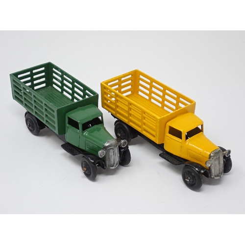 1228 - Two unboxed Dinky Toys No.25F Market Garden Lorries, one green and one yellow