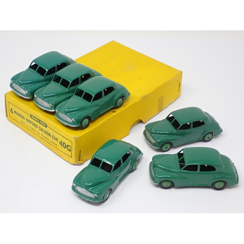 1254 - A Dinky Toys No.40G full Trade Box containing six green Morris Oxford Saloon Cars