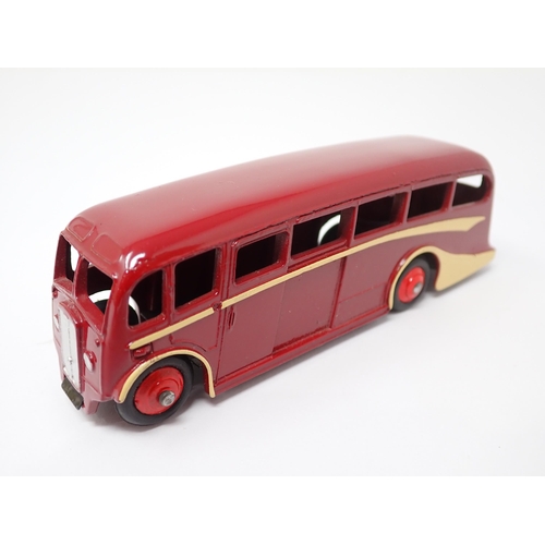 1255 - A Dinky Toys No.29G Trade Box containing a single maroon Luxury Coach