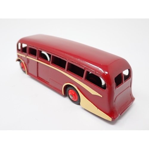 1255 - A Dinky Toys No.29G Trade Box containing a single maroon Luxury Coach