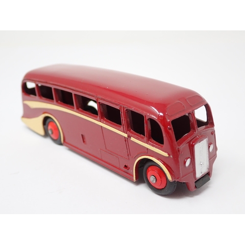 1255 - A Dinky Toys No.29G Trade Box containing a single maroon Luxury Coach