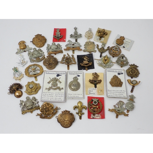 1337 - Thirty five Lancashire and Yorkshire Regiment Cap Badges, some possibly re-strikes