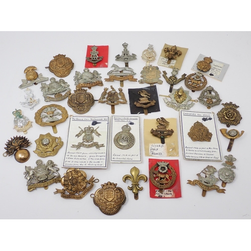 1337 - Thirty five Lancashire and Yorkshire Regiment Cap Badges, some possibly re-strikes