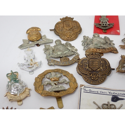 1337 - Thirty five Lancashire and Yorkshire Regiment Cap Badges, some possibly re-strikes