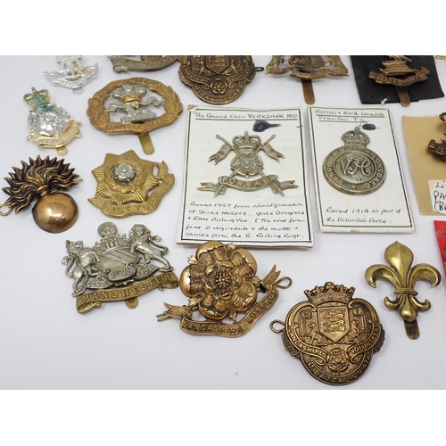 1337 - Thirty five Lancashire and Yorkshire Regiment Cap Badges, some possibly re-strikes