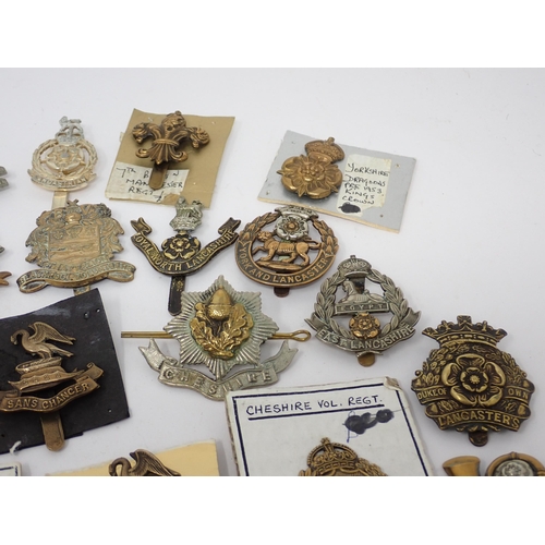 1337 - Thirty five Lancashire and Yorkshire Regiment Cap Badges, some possibly re-strikes