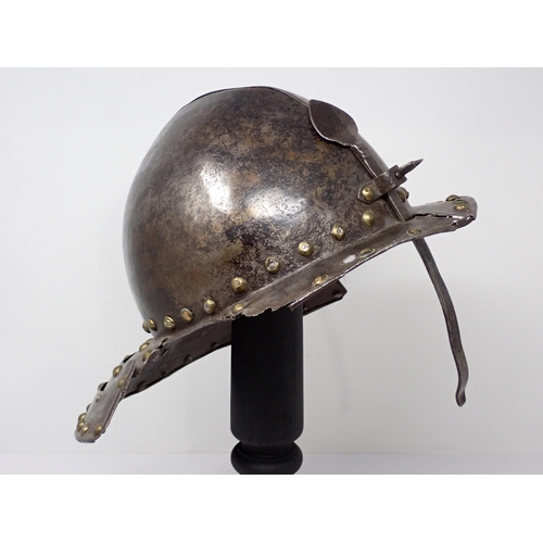 1362 - A 17th century continental cavalry helmet. Two piece pot with three lame articulated neck guard and ... 