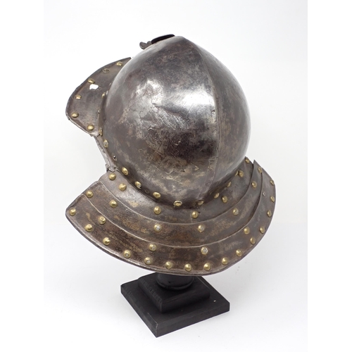 1362 - A 17th century continental cavalry helmet. Two piece pot with three lame articulated neck guard and ... 