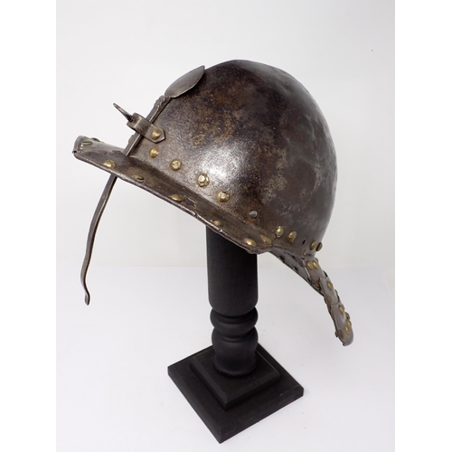 1362 - A 17th century continental cavalry helmet. Two piece pot with three lame articulated neck guard and ... 